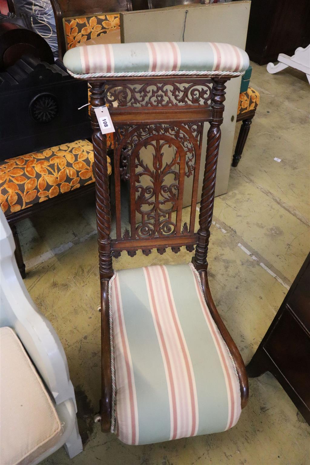 A Victorian carved mahogany prie dieu chair